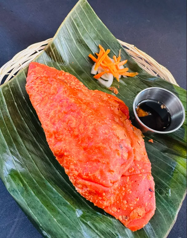 Ilocos Empanada — Filipino savoury pastry with longganisa and egg at Jeepney Winnipeg